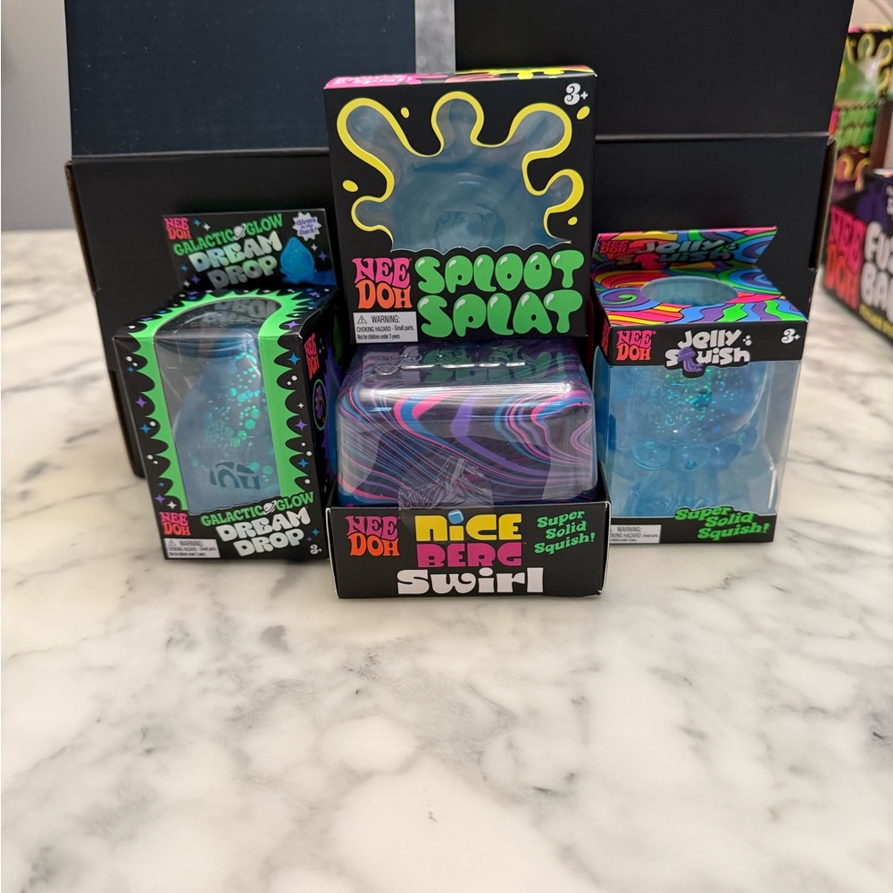 Nee Doh Sploot Splat & Nice Berg Swirl Putty Trio - Blue & Black Packaging